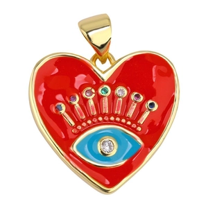 Macro detail of red heart pendant with evil eye motif and colorful crystal inlay