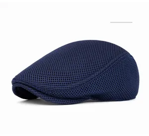 Detail of navy blue mesh ivy cap showing breathable honeycomb texture for summer