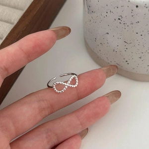 Minimalist 925 sterling silver infinity ring with beaded texture and adjustable open band
