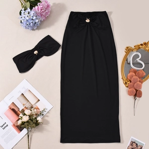 Detail of sexy black bodycon maxi dress with gold shell buckles and hollow-out design