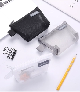 Three mesh organizer pouches in black, grey, and white with zipper handles and tags