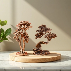 Set of two vintage brass pine tree sculptures on wooden tray for office desk decor