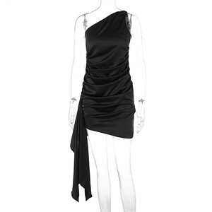 Detail of black ruched one-shoulder dress with elegant long flowing sash and satin finish