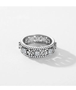Detail of S925 sterling silver daisy ring with hollow floral design and pavé zircons