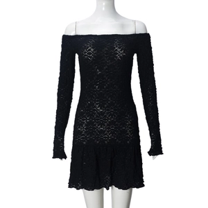 Detail of black floral lace texture on off-shoulder long sleeve bodycon dress