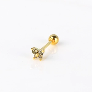 Detailed macro of gold flower stud earring with olive cubic zirconia and ball screw back