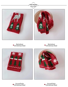 Close-up of red Christmas knit scarves featuring white reindeer and snowflake patterns