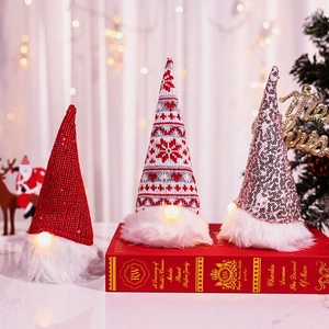Three-piece glowing Christmas gnome plush set with sequins and LED lights on books