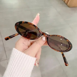 Classic tortoiseshell oval frame sunglasses with dark brown lenses in a retro fashion style