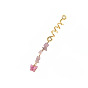 Close-up of golden spiral hair ring with purple stone beads and a pink resin butterfly charm
