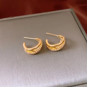 Elegant 18K gold plated crisscross hoop earrings with pavé cubic zirconia accents