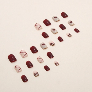 French wine red heart nails with classic diamond lattice pattern and glossy finish