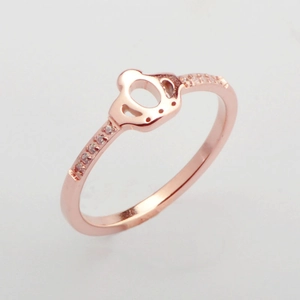 Detailed macro view of a rose gold crown ring with micro-pave cubic zirconia accents