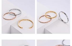 Detail showing the snap closure mechanism and geometric patterns on metal bangles
