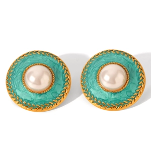 Detail of vintage French court earrings with mint green enamel and white pearl accents