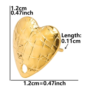 Detailed view of gold heart-shaped stainless steel earring studs with grid texture