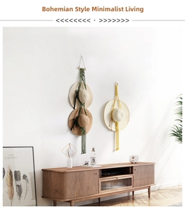 Detail of bohemian handmade cotton rope wall hanging hat organizer with wood bar