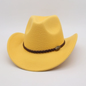 Detail of yellow felt cowboy hat with braided leather band and metal bull head emblem