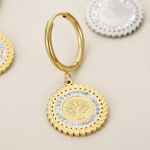 Close-up of 18K gold plated Tree of Life earrings with sparkling crystal accents