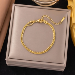 Double-layered 18k gold plated stainless steel bracelet with rice beads and woven chains