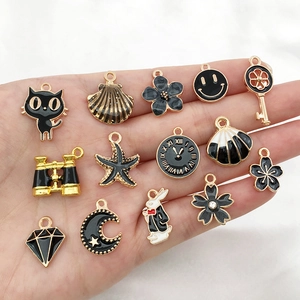 Set of 14 black and gold alloy drip oil pendants for DIY jewelry and keychain making