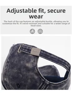Detail of adjustable metal buckle on washed navy denim baseball cap for custom fit