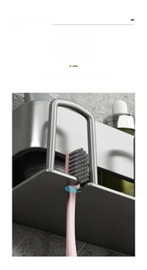 Detail of gunmetal U-shaped wall mount bracket securely holding a pink electric toothbrush