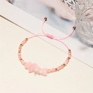 Detailed shot of handmade pink crystal beaded bracelet with adjustable woven strap