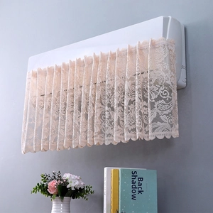 Detail of white lace air conditioner cover with fine floral mesh and wavy edges