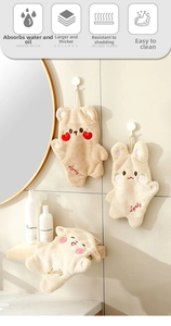 Detail of soft coral fleece hand towel with beige bear design and Lovely embroidery
