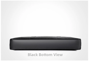 Detail view showing flat bottom and embossed leather texture on black business briefcase