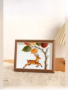 Detailed view of the reindeer leaf specimen art within the wooden shadow box frame