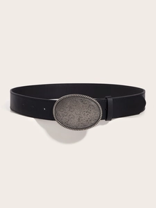 Retro black leather belt with embossed silver floral buckle shown from a 45-degree angle