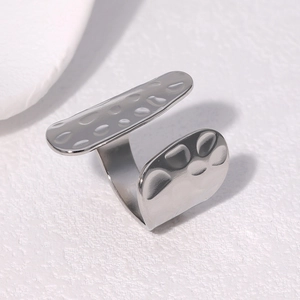 Macro detail of silver adjustable open ring featuring unique hammered metal texture surface