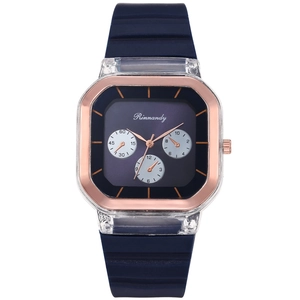 Detail of square quartz watch with transparent case and navy blue silicone wavy strap