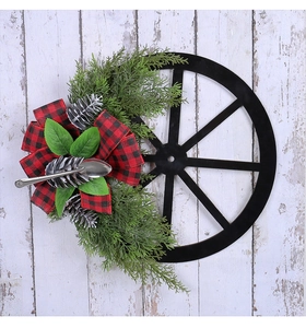 Farmhouse Christmas wreath with black wheel frame, pine branches, and buffalo plaid bow