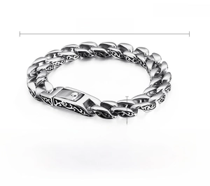 Detail view of retro stainless steel curb chain bracelet with vintage floral patterns