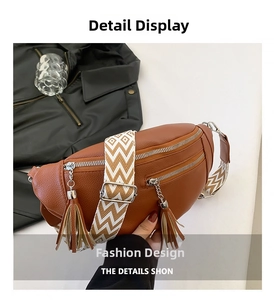 Detail of brown litchi pattern leather bag with geometric strap and long tassel zipper