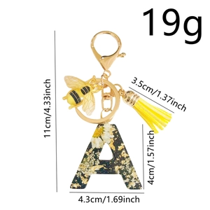 Resin letter A keychain with yellow flower, gold bee charm and tassel decorations