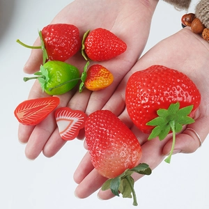 Lifelike artificial strawberry models set with red and green fruit for display props