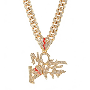 Iced out gold Cuban link necklace with red cracked heart and LOVE pendant