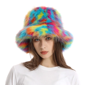 Close-up of fluffy rainbow faux fur bucket hat with soft long plush texture