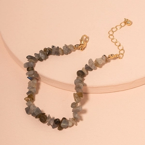 Detailed view of bohemian labradorite chip stone bracelet with golden adjustable clasp