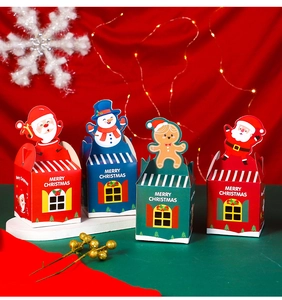 Close-up of Christmas gift boxes with Santa and Snowman designs for candy packaging