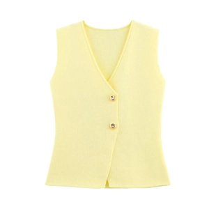 Detailed close-up of V-neck knitted vest in light yellow with gold relief buttons
