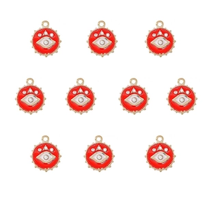 Macro detail of red enamel evil eye charms with gold plating and sparkling rhinestones