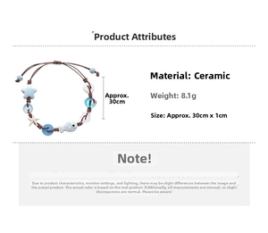 Detail of handmade ceramic star and fish beads on a woven bracelet, size 30cm and 8.1g