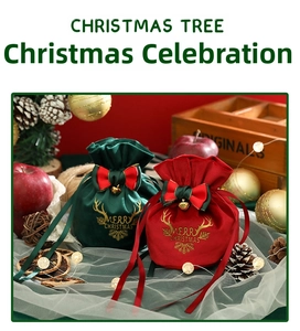 Detail of red and green velvet Christmas gift bags with gold antlers and bells
