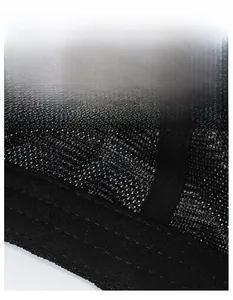 Detailed macro view of the breathable black mesh material and wide sweatband on the cap