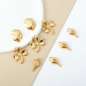 Golden stainless steel four-leaf clover and leaf charms for DIY jewelry making